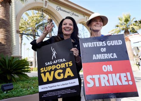 An end in sight? Striking writers and Hollywood studios spend second full day in negotiations